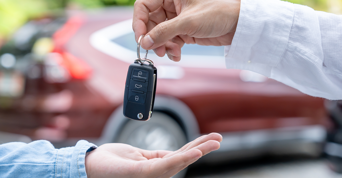 Customer trading in a financed vehicle at a dealership in Quebec